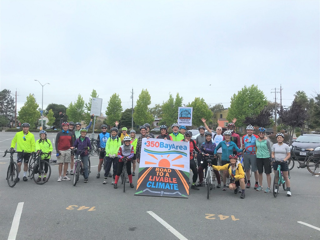 350 Bay Area bikers with sign "Road to a Livable Planet"